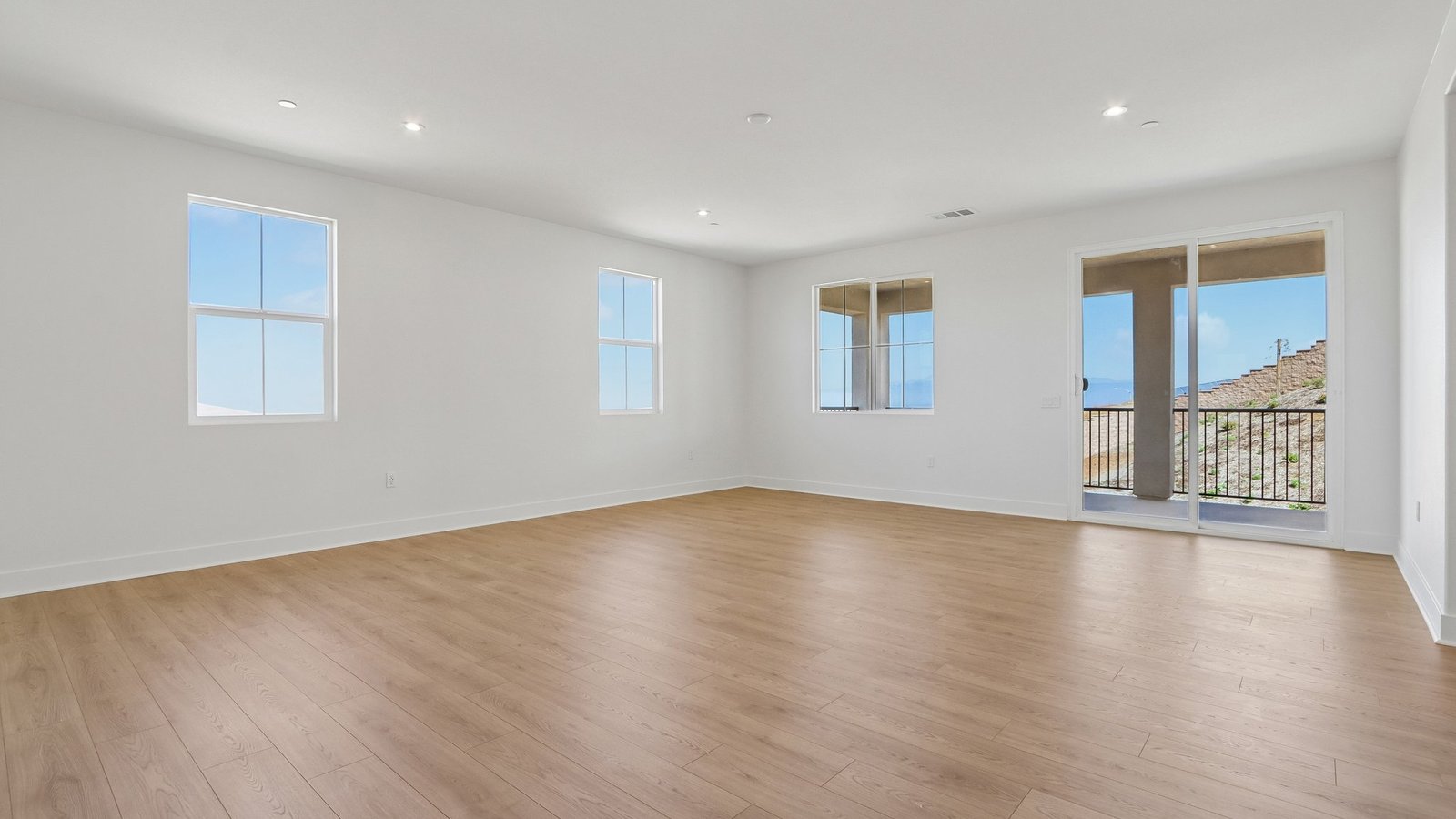 spacious master bedroom with slider and outdoor patio