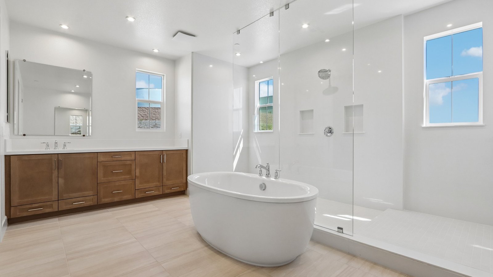 master bathroom with standalone tub and large walk in shower
