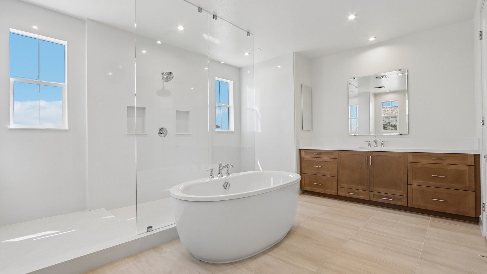 master bathroom with standalone tub and large walk in shower