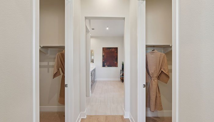 Primary bedroom walk-in closets