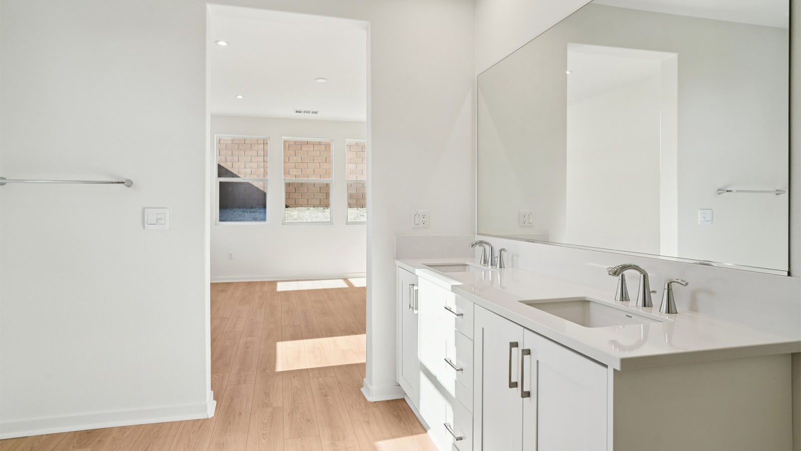 Primary bathroom with his and hers sinks and shower