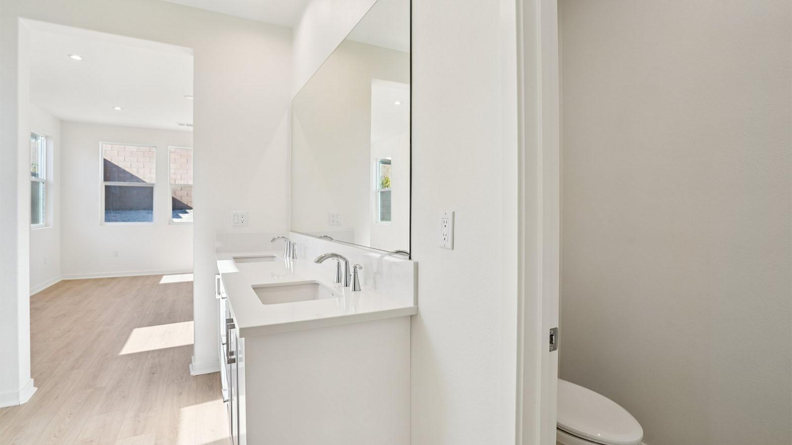 Primary bathroom with his and hers sinks and shower