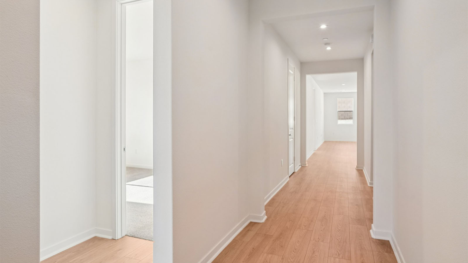 Hallway with laminate wood flooring