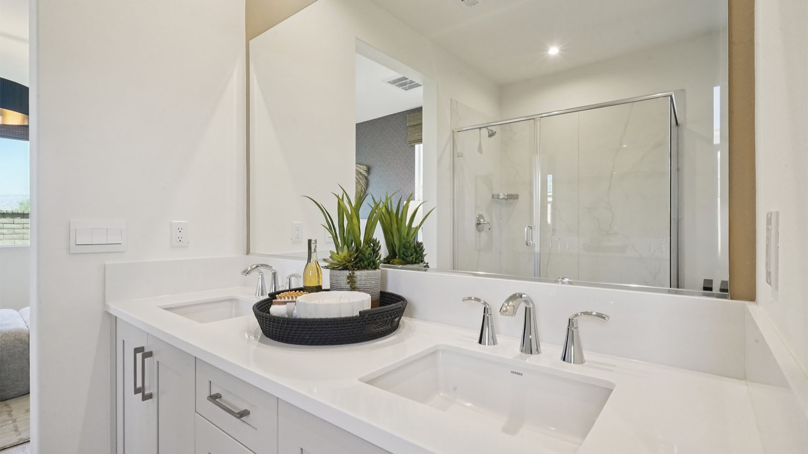 Primary bathroom with dual vanities