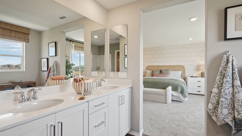 Primary bathroom with white cabinets