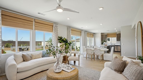 Open-concept great room, dining, and kitchen space
