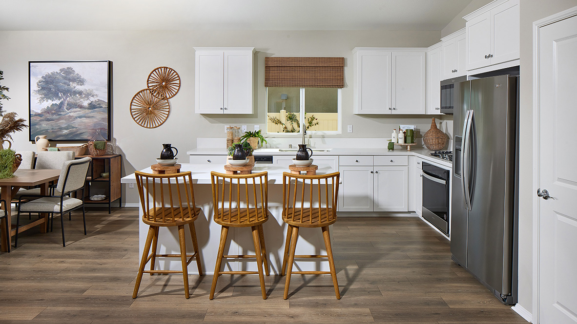 Modern concept kitchen with white cabinetry and stainless-steel appliances