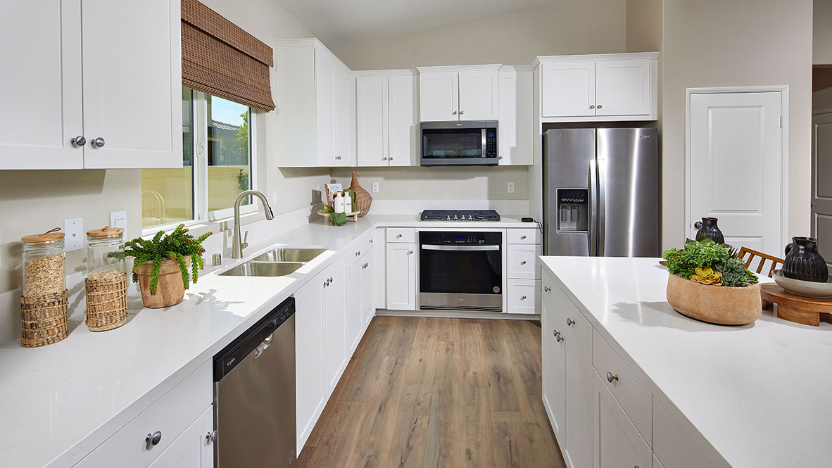 Kitchen peninsula with white cabinetry