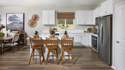 Kitchen with white cabinetry and stainless-steel appliances