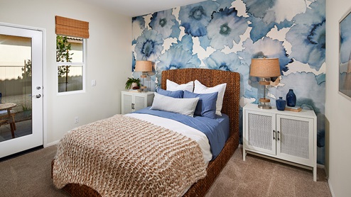Multigen private suite bedroom with door to side patio