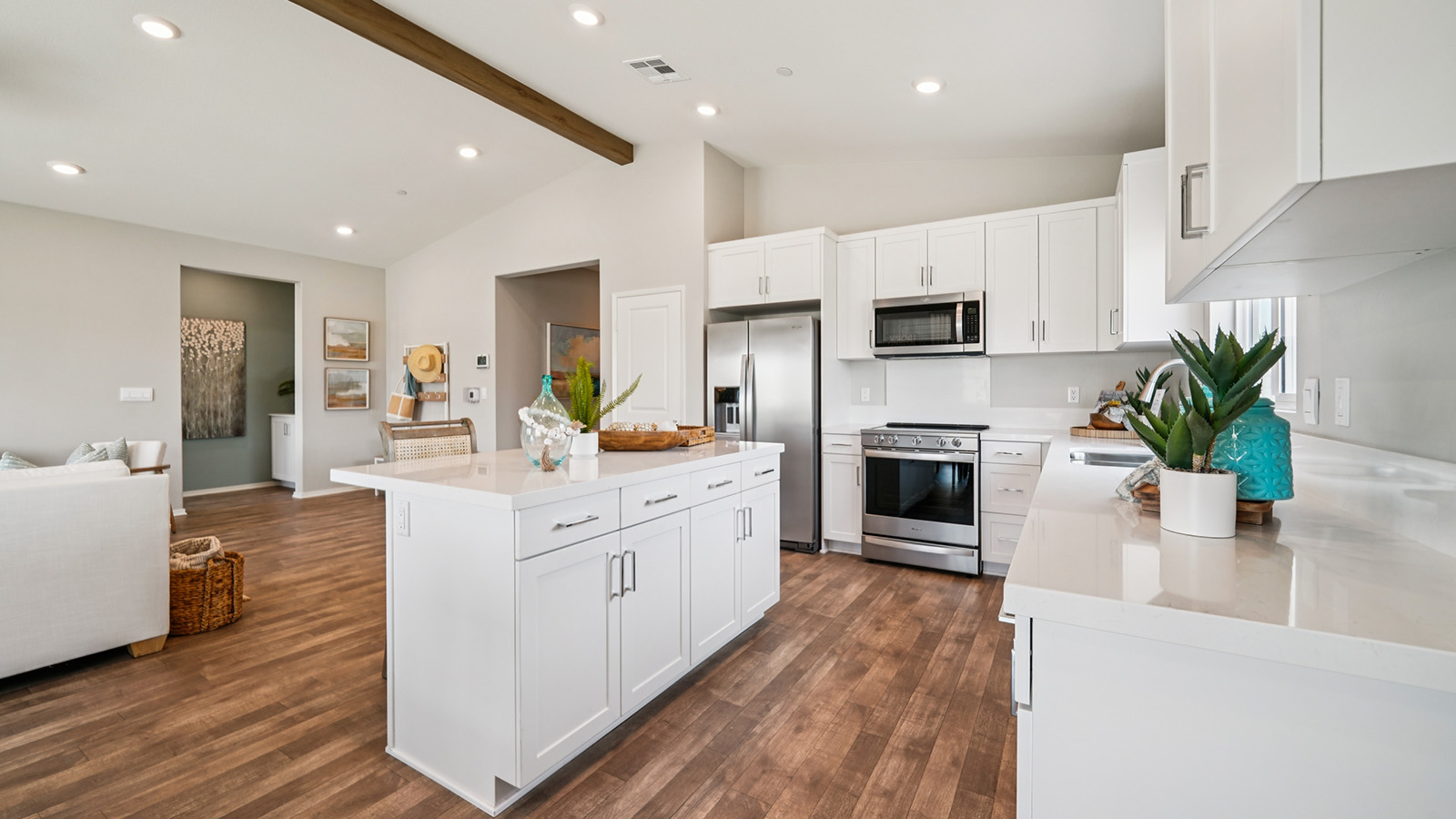 Large kitchen island with white cabinets