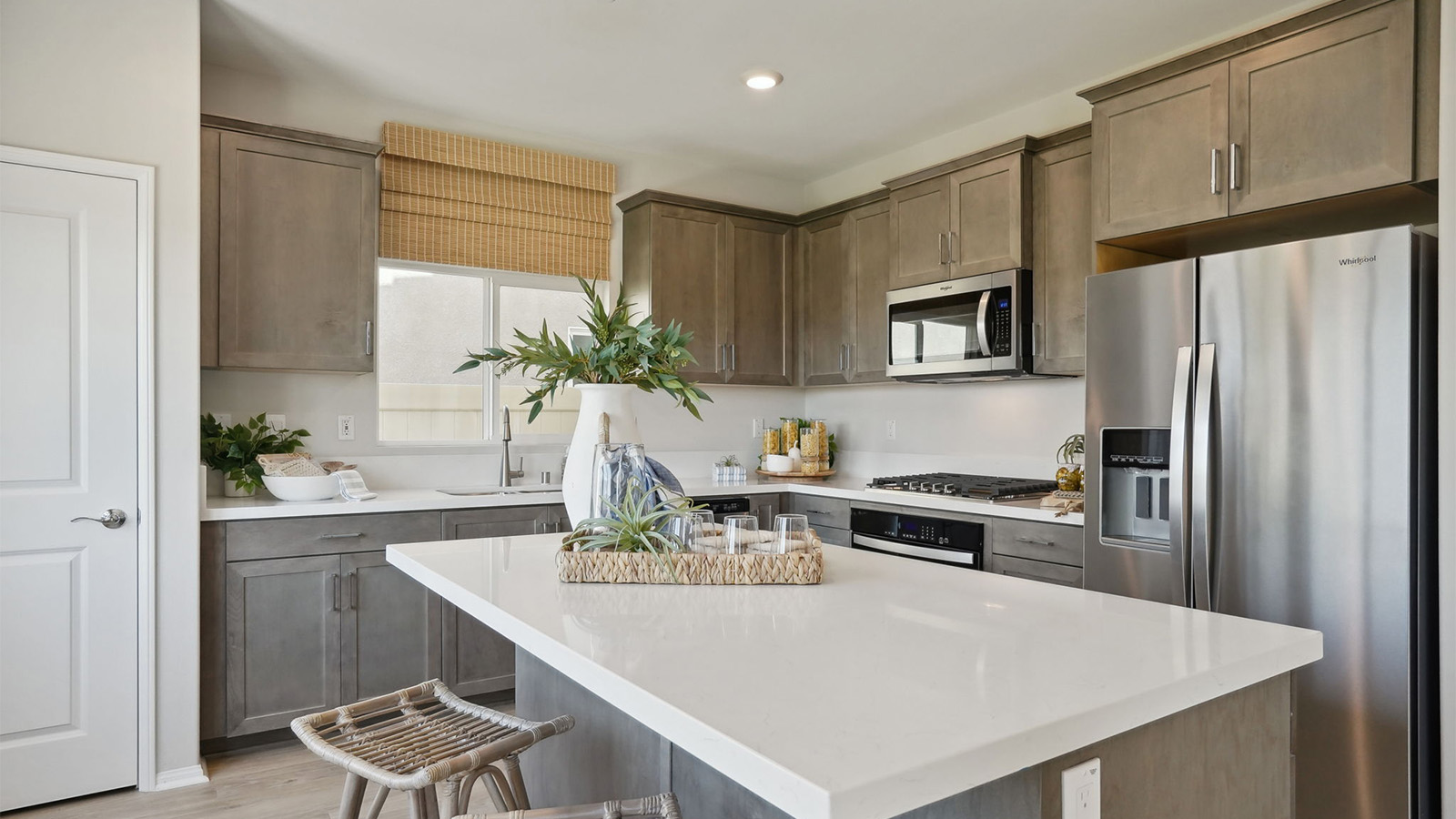 Spacious kitchen with an island and stainless-steel appliances