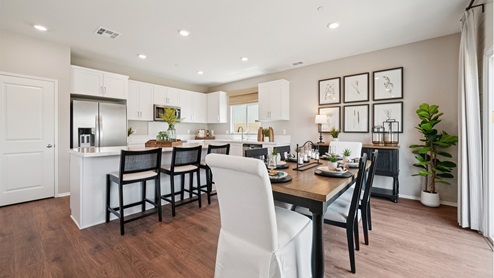 Open concept kitchen and dining spaces
