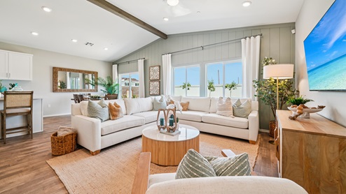 Spacious living space with big windows looking into backyard