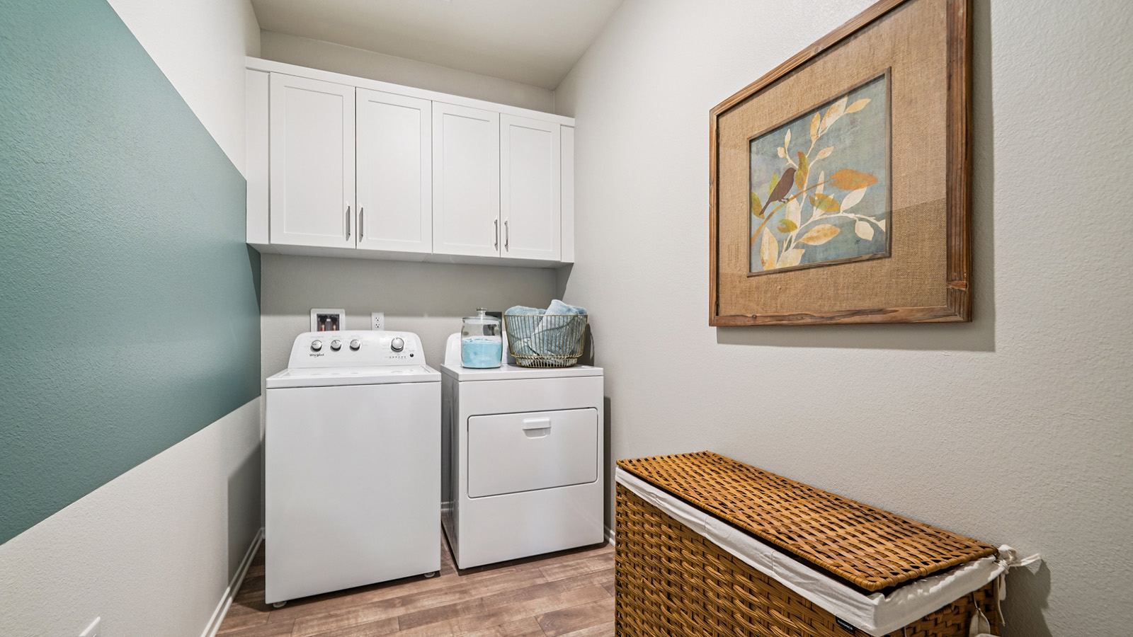 Laundry room with upper cabinets