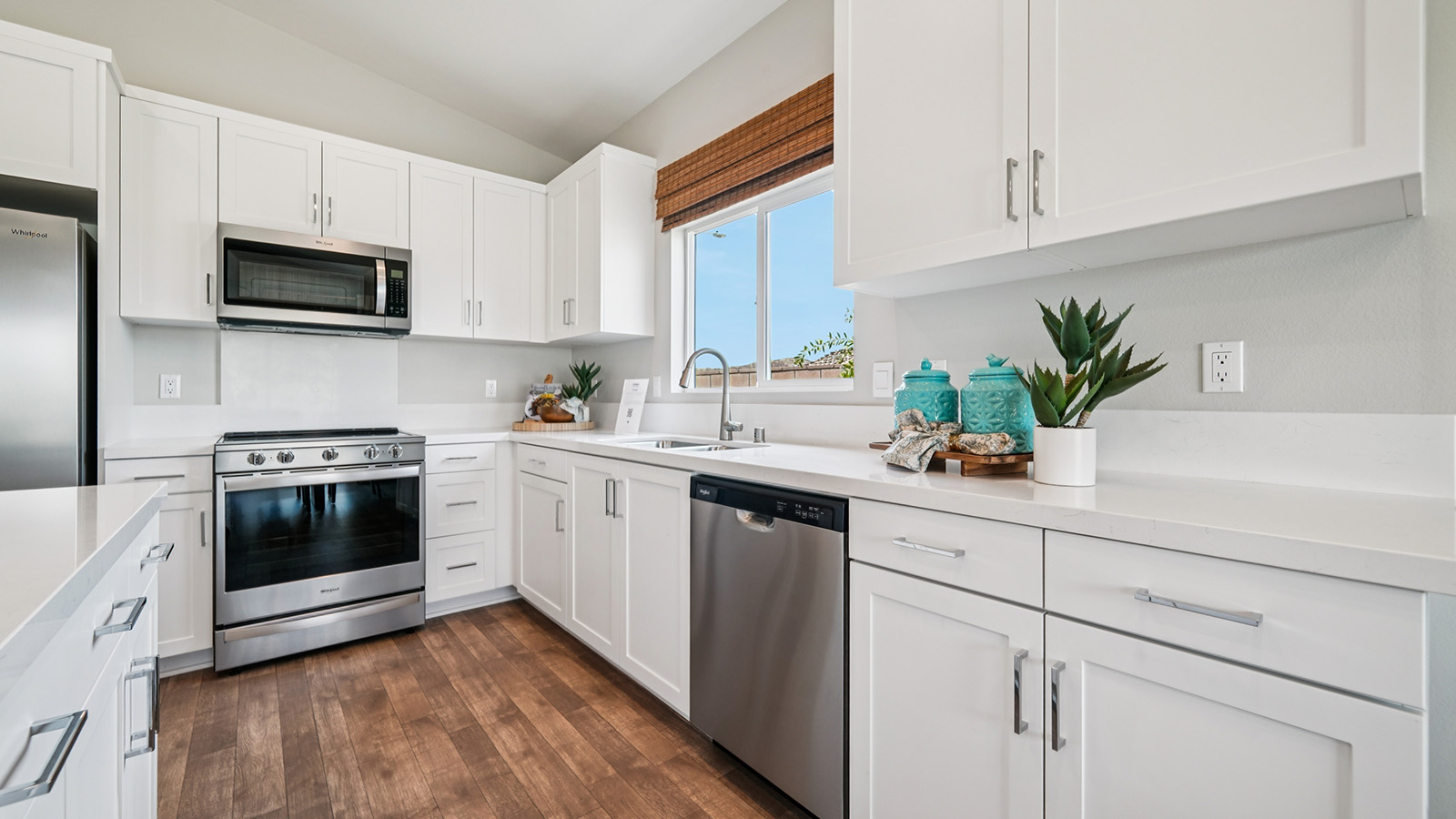 Kitchen with white cabinets and stainless steel appliances