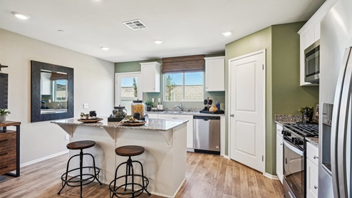 Kitchen with white cabinets and granite countertops