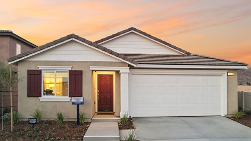 Exterior of a single story home with a covered entry and 2-car garage