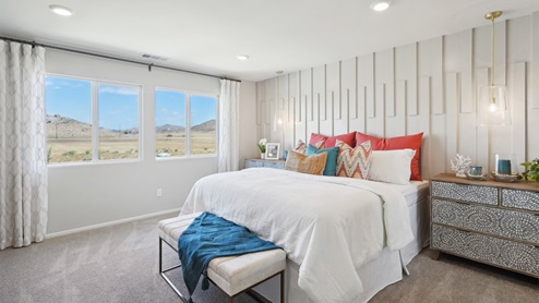 Primary bedroom with large windows