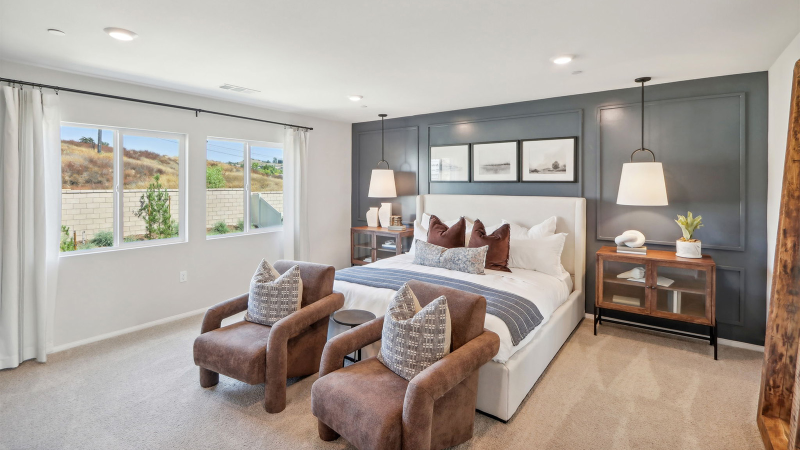 Primary bedroom with large windows