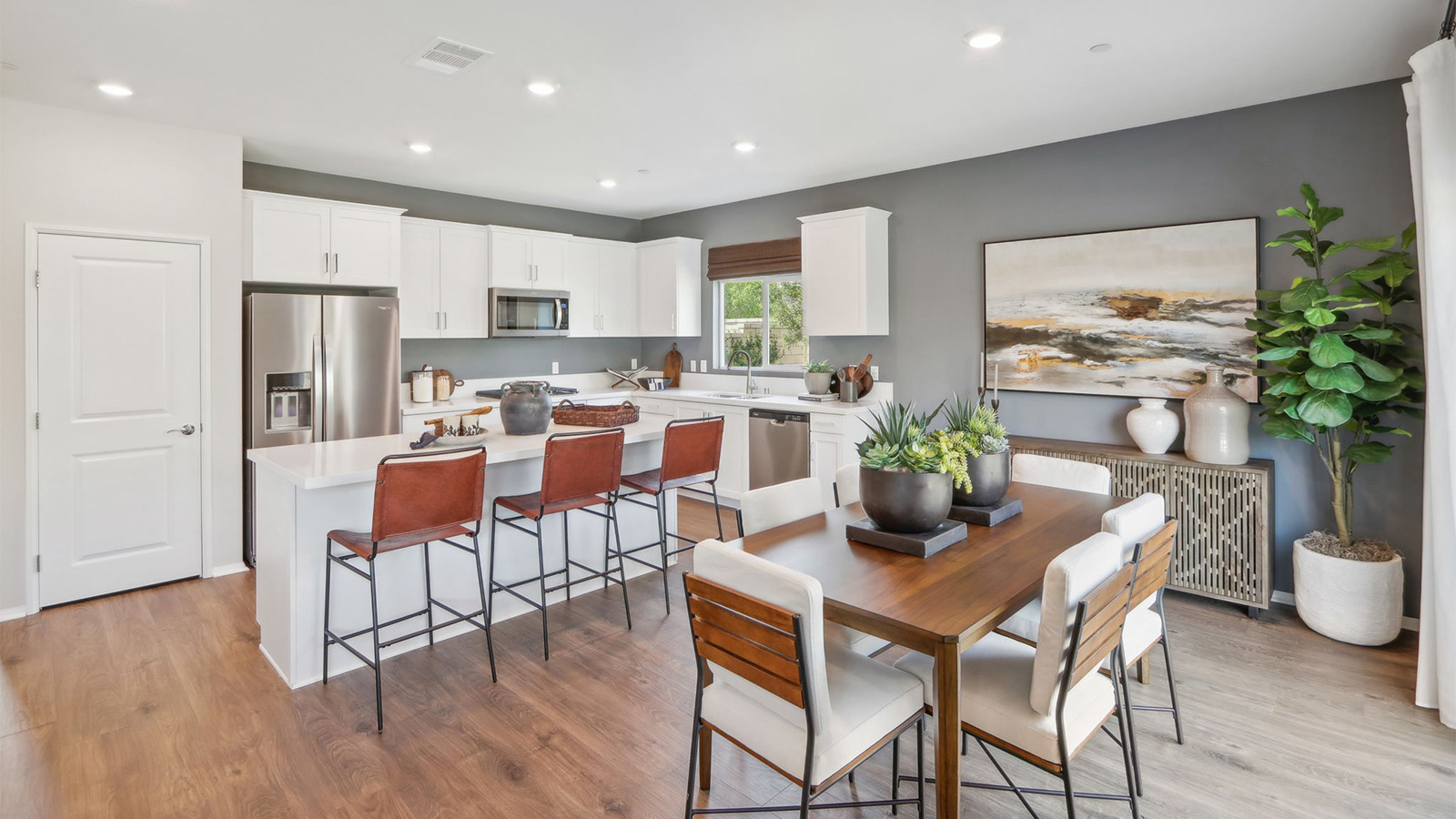 Kitchen with white shaker style cabinets