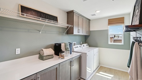 Spacious laundry room with cabinet space