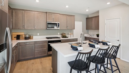 Kitchen with white quartz countertops
