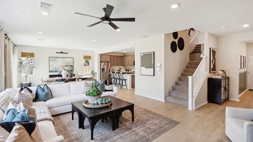 Open concept living, dining, and kitchen space