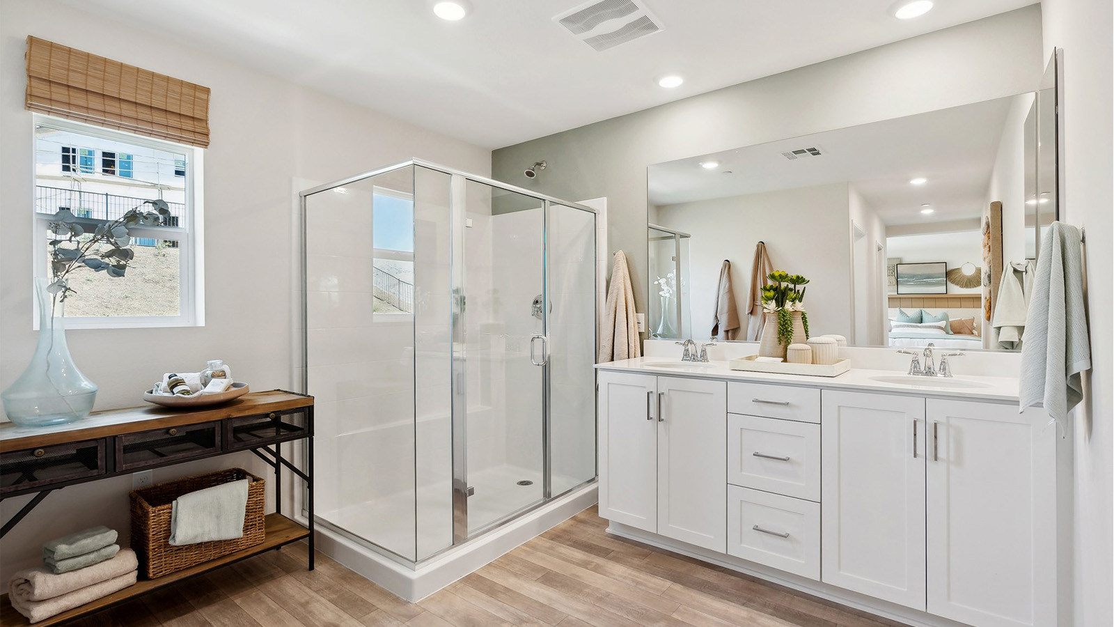 Primary bathroom with white cabinets and double sinks