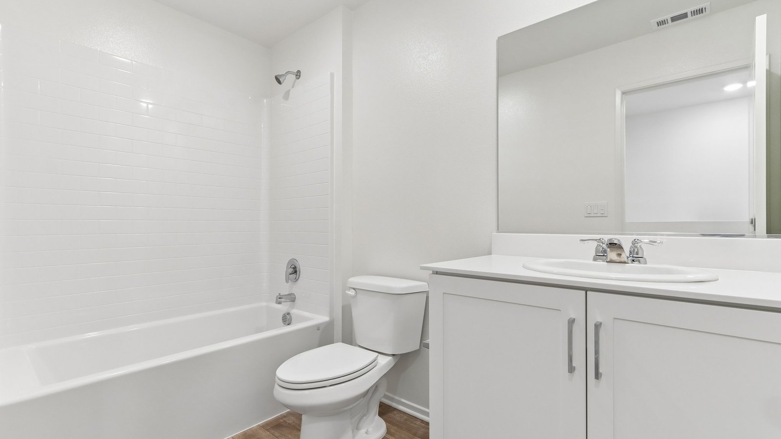 secondary bathroom with tub shower combo