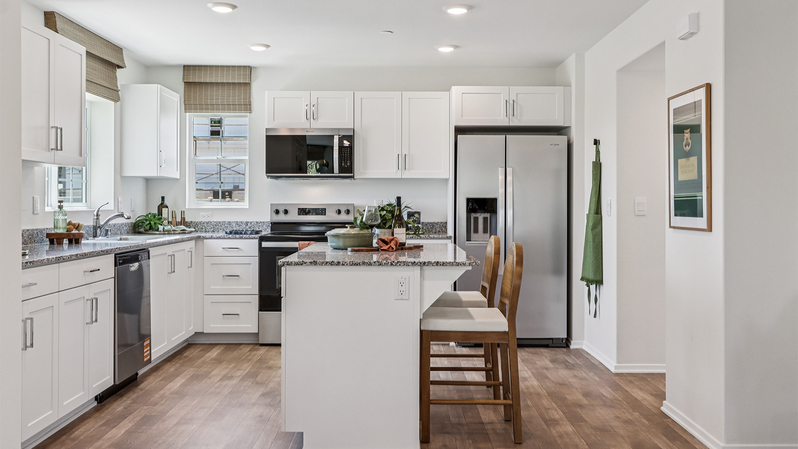 Kitchen with an island and white cabinets