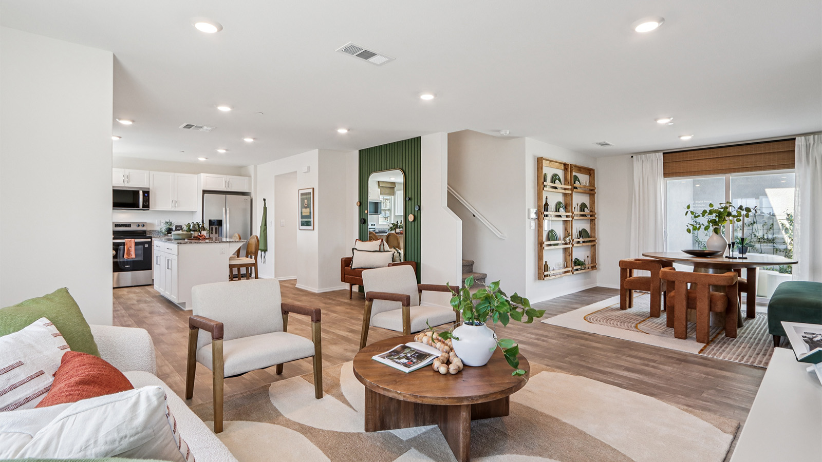 Open concept great room, kitchen, and dining space