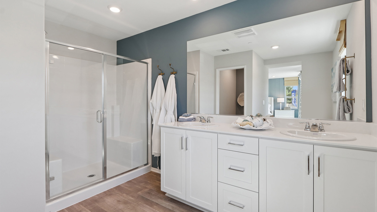 Primary bathroom with white cabinets