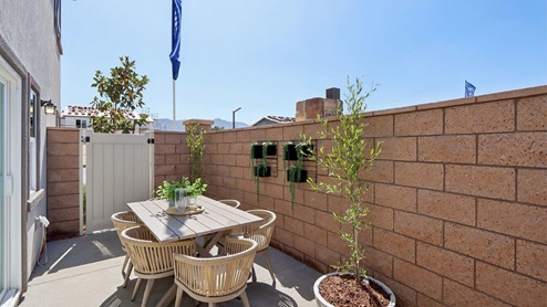 Backyard patio with outdoor dining table