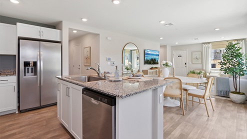 Kitchen and dining space with stainless-steel appliances