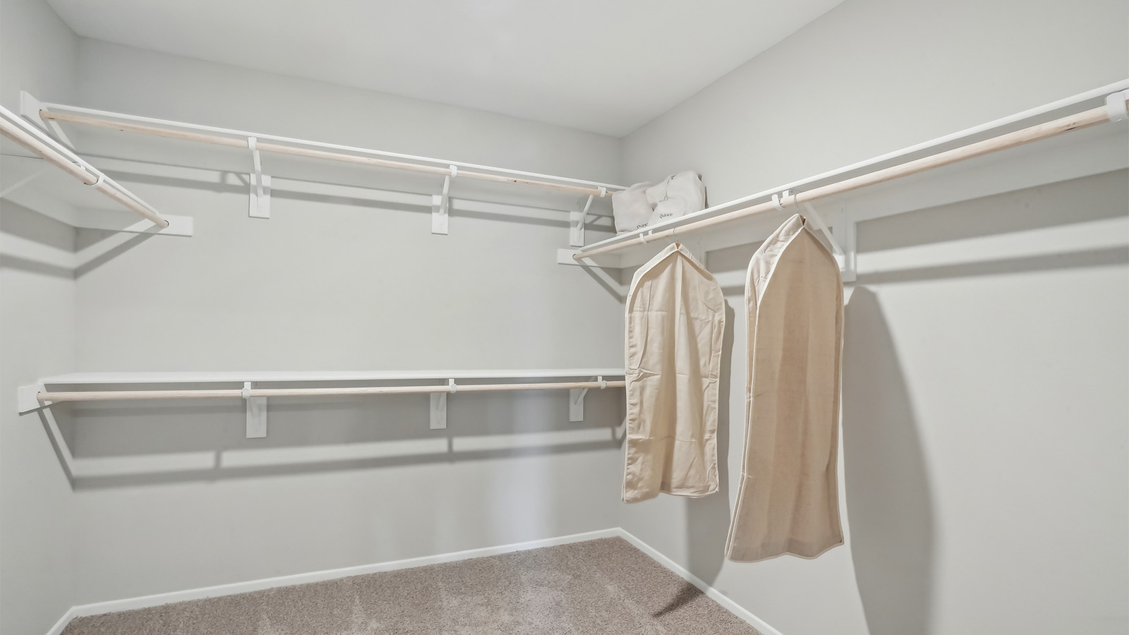 Primary bedroom walk-in closet
