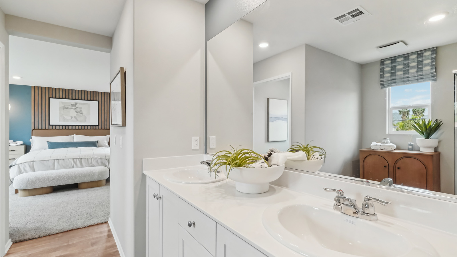 Primary bathroom with white cabinets