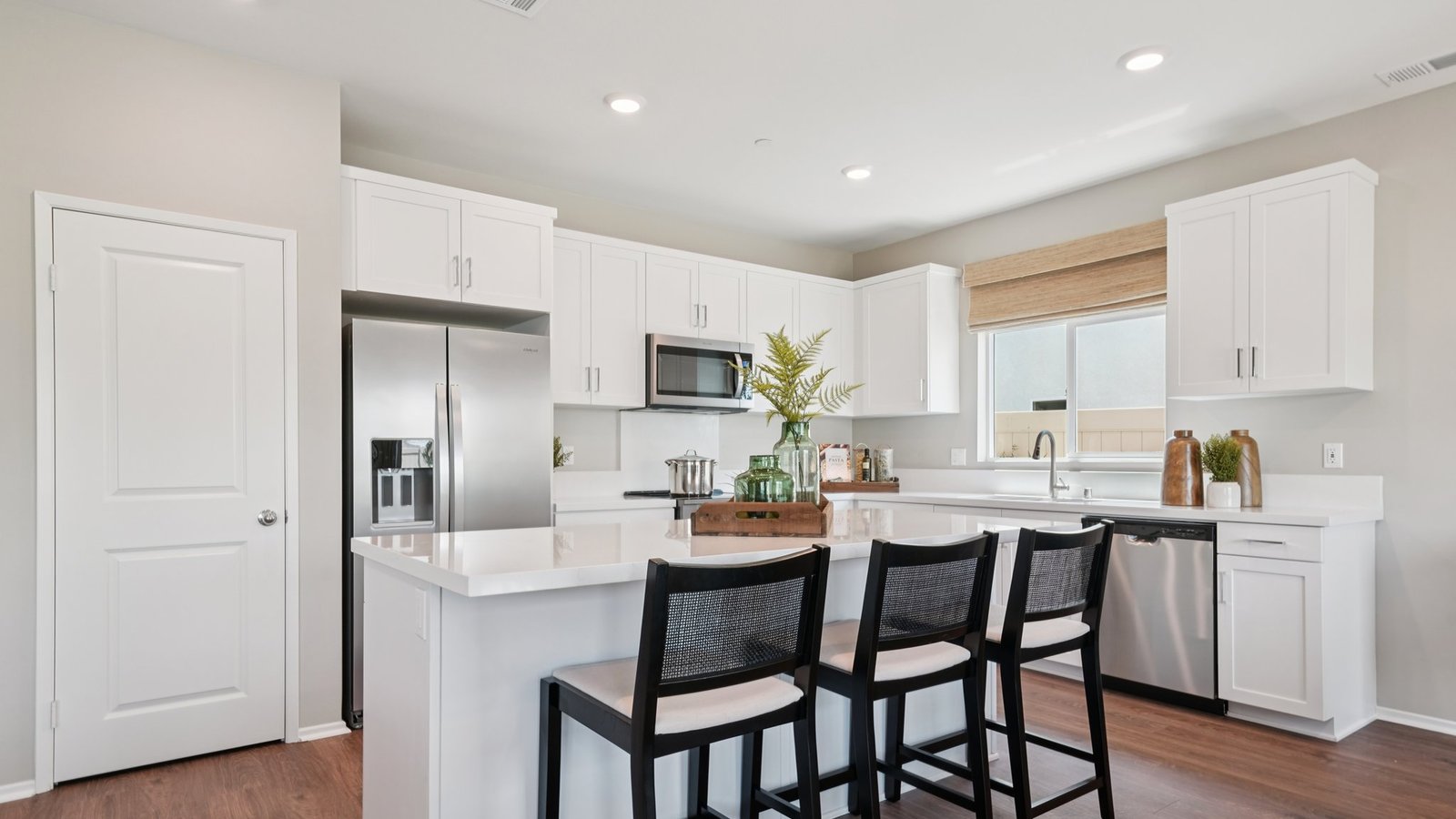 Kitchen with white cabinets and an island