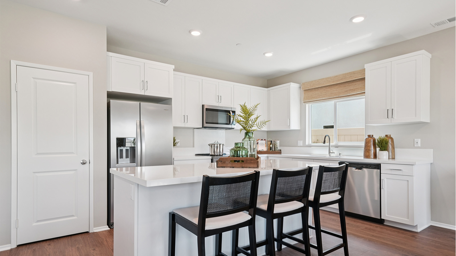 Kitchen with white cabinets and an island
