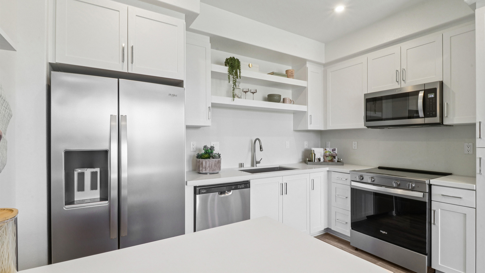 Kitchen with white cabinets and stainless-steel appliances