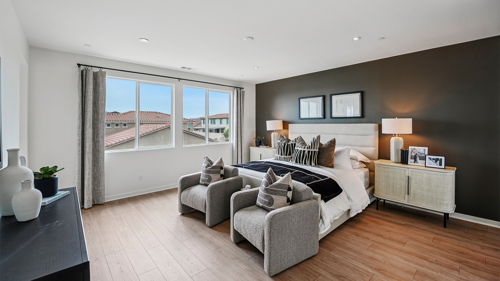 Primary bedroom with large windows