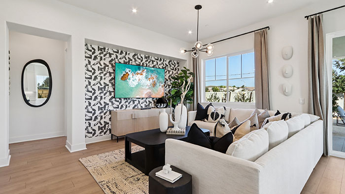 Interior living area with large window and accent wall