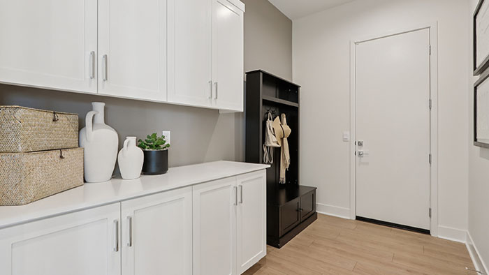 Interior mudroom with white cabinets