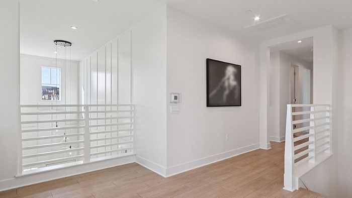 Interior upstairs loft area open to staircase