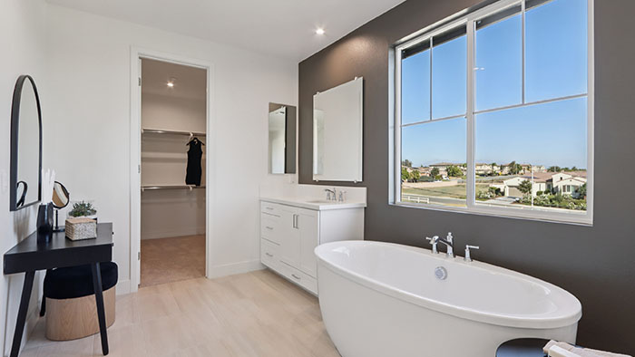 Interior bathroom with bath tub and walk-in closet