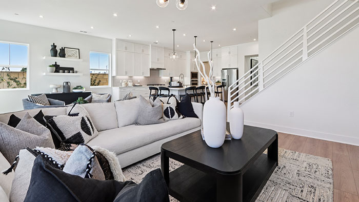 Interior living area open to staircase and kitchen