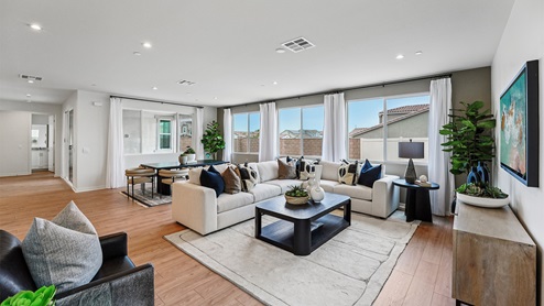 Interior living and dining space with large windows