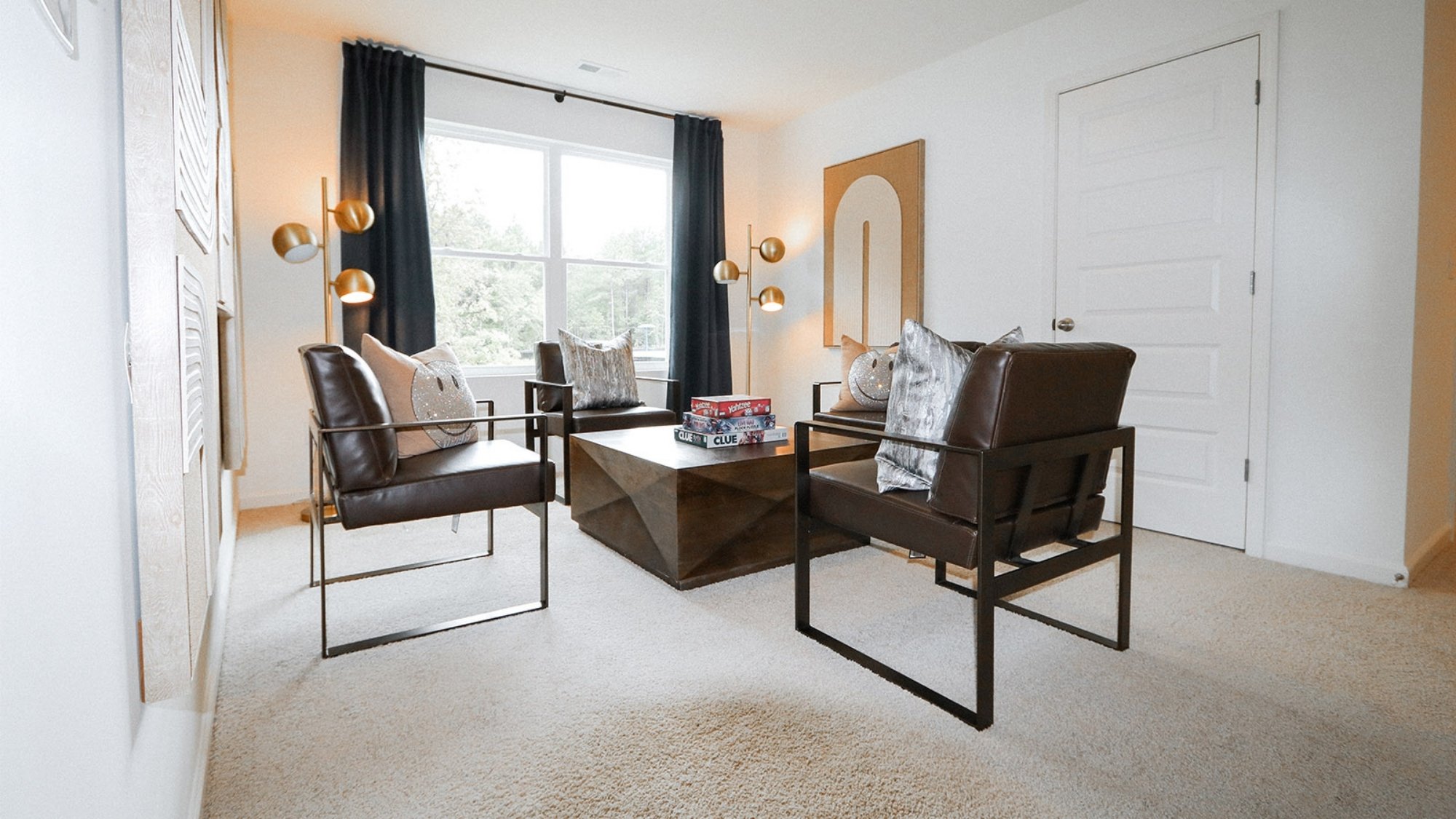 One of the bedrooms is shown here staged as an upstairs living area.