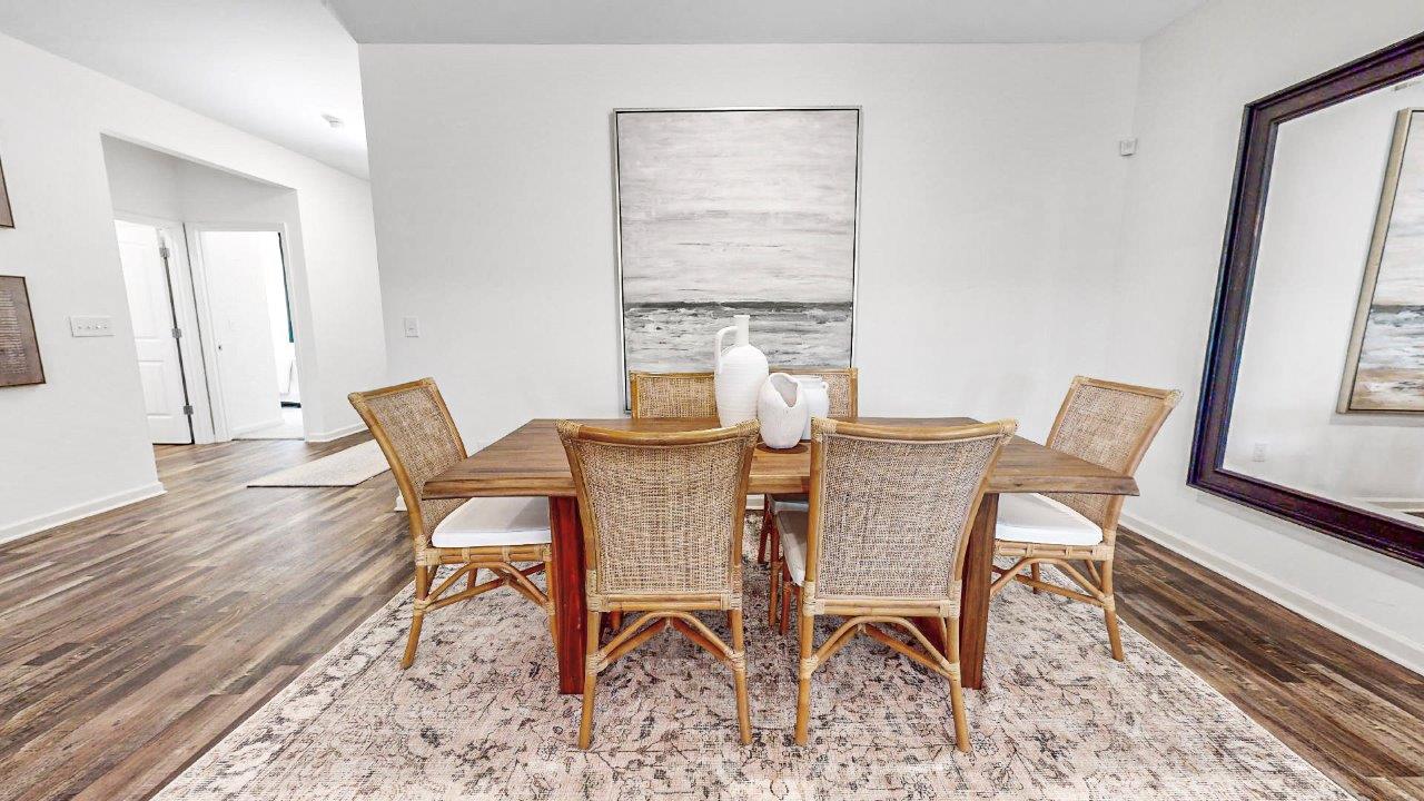 Furnished dining room with table and six chairs