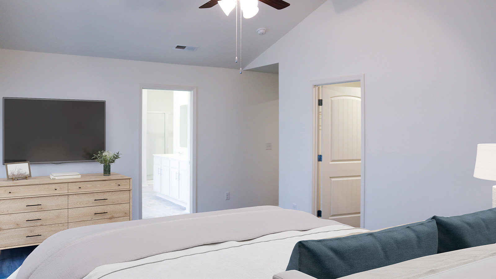 The spacious primary suite also features a roomy primary bathroom.